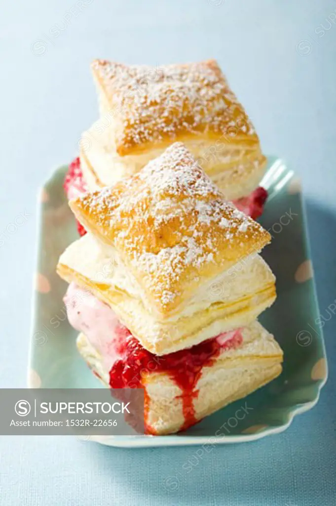 Puff pastries filled with raspberry ice cream & raspberry sauce