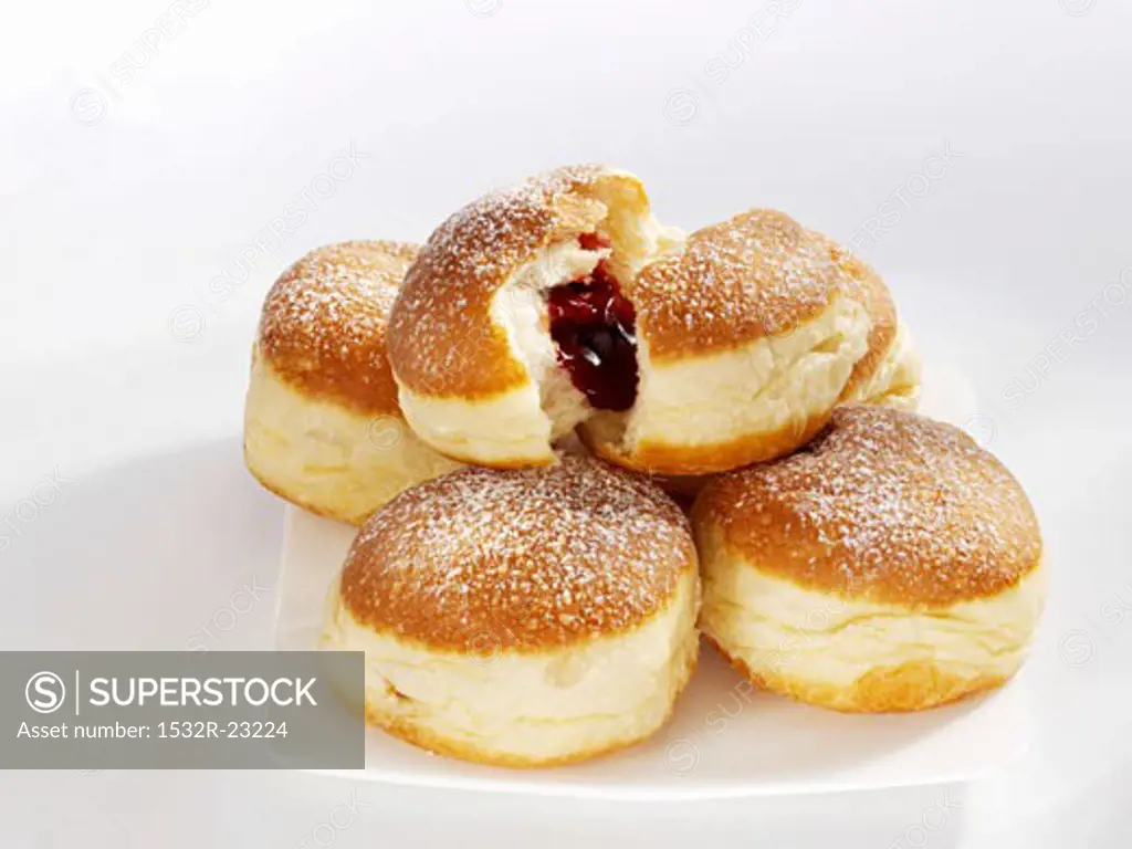 Five doughnuts on a serving plate