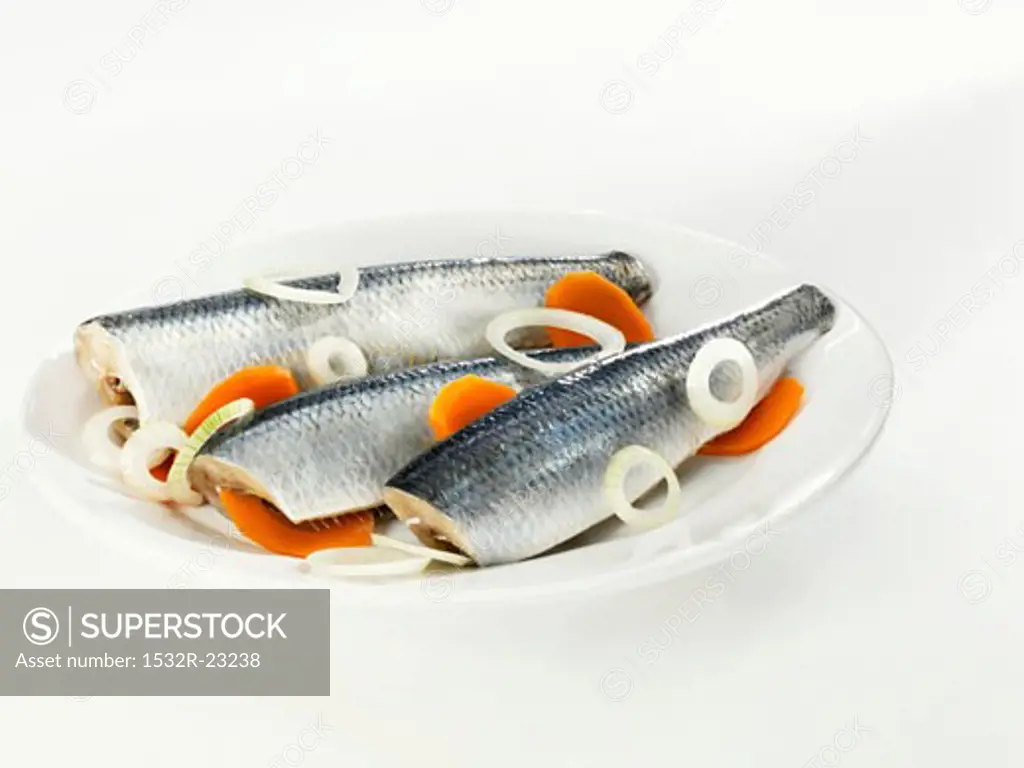 Three Bismarck herrings with onions and carrots