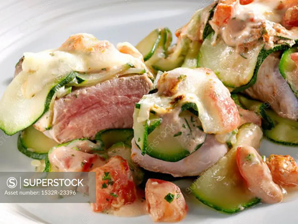 Pork fillet with tomatoes, courgettes and mozzarella