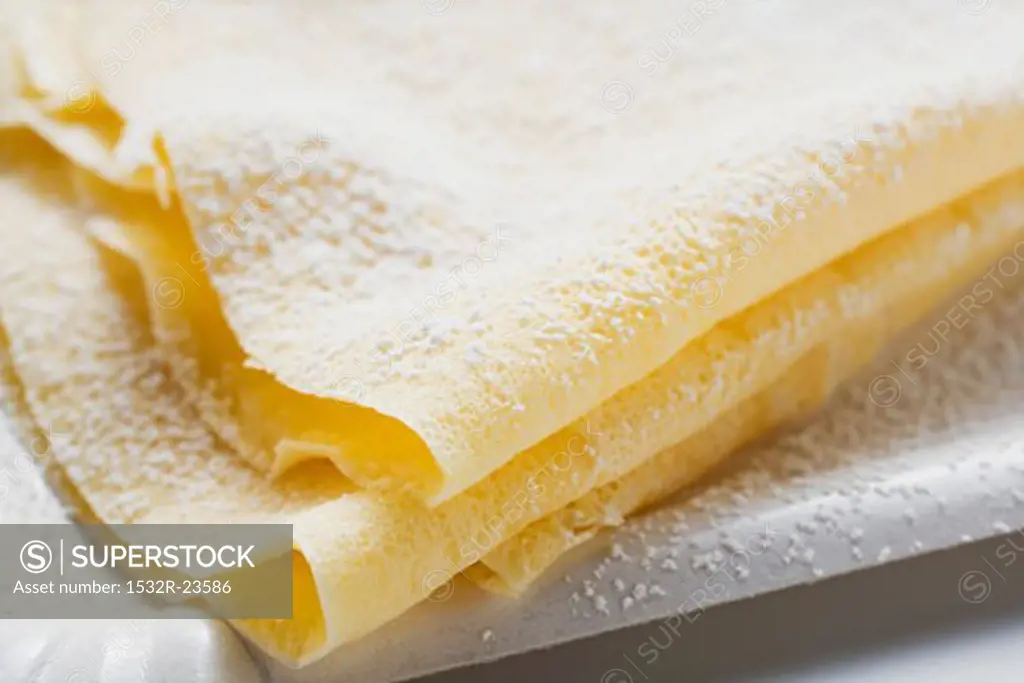Freshly-made crêpes with icing sugar