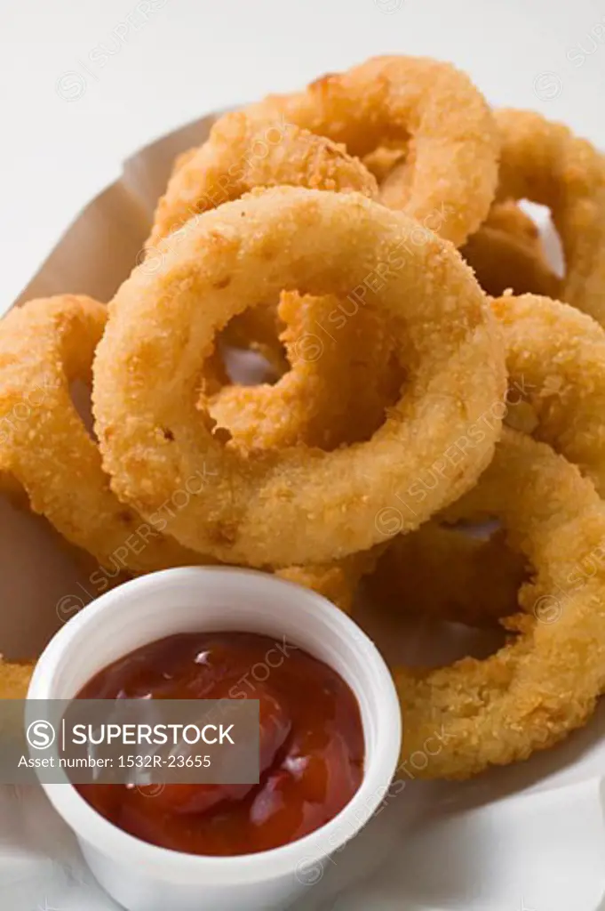Squid rings in paper dish with dip