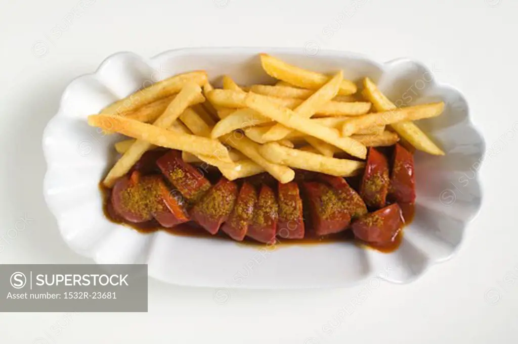 Sausage, cut into slices, with ketchup and chips
