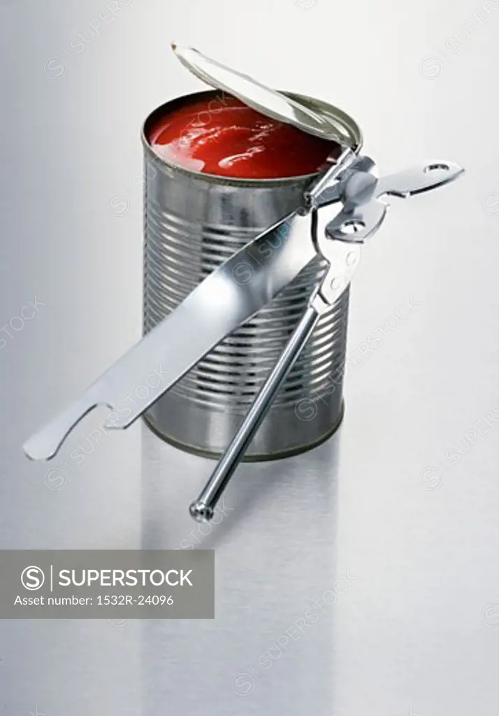 Opened tin of tomatoes with tin opener