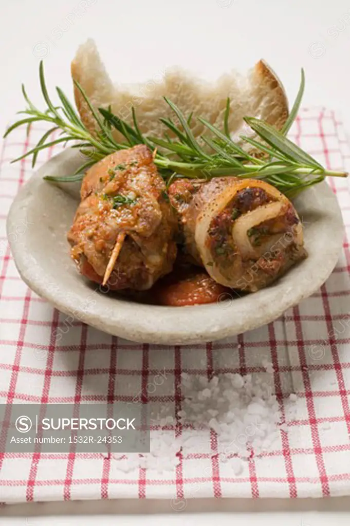 Belly pork rolls with tomato pesto and rosemary