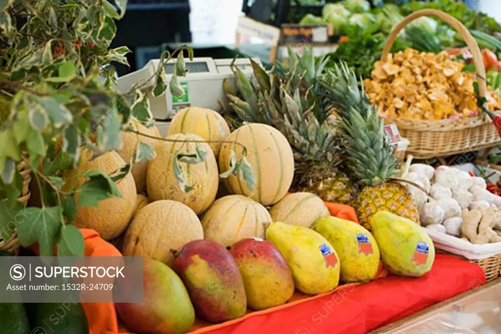 Market stall with fruit, vegetables, mushrooms and herbs