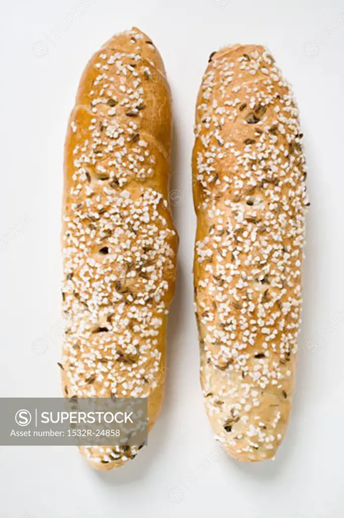 Two salted pretzel sticks with caraway