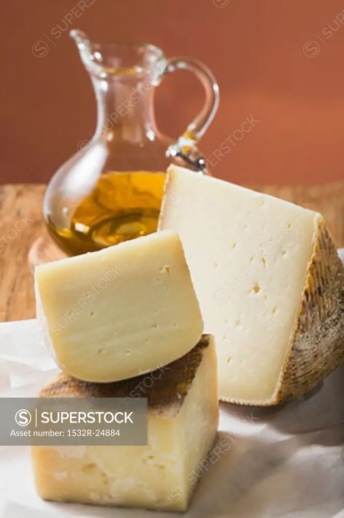 Three pieces of cheese and olive oil