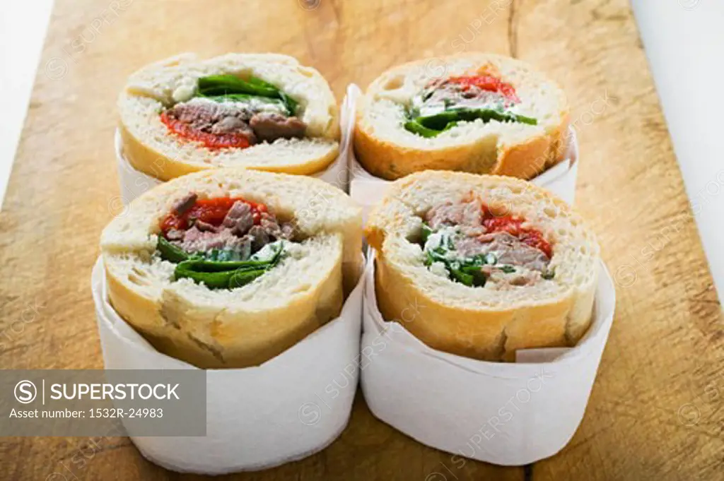 Sandwich rolls filled with pork and peppers