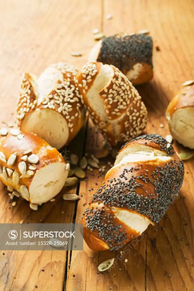 Assorted pretzel rolls on wooden background