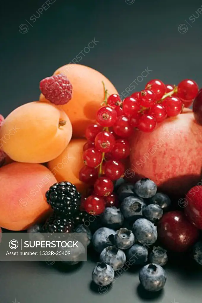 Fruit still life with stone-fruit and berries