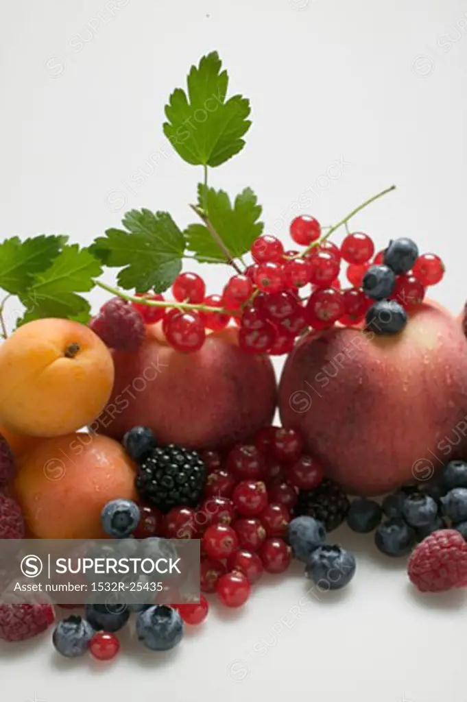 Fruit still life with stone-fruit, berries & leaves (detail)