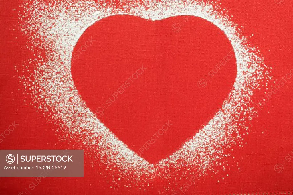 Red heart shape outlined in icing sugar