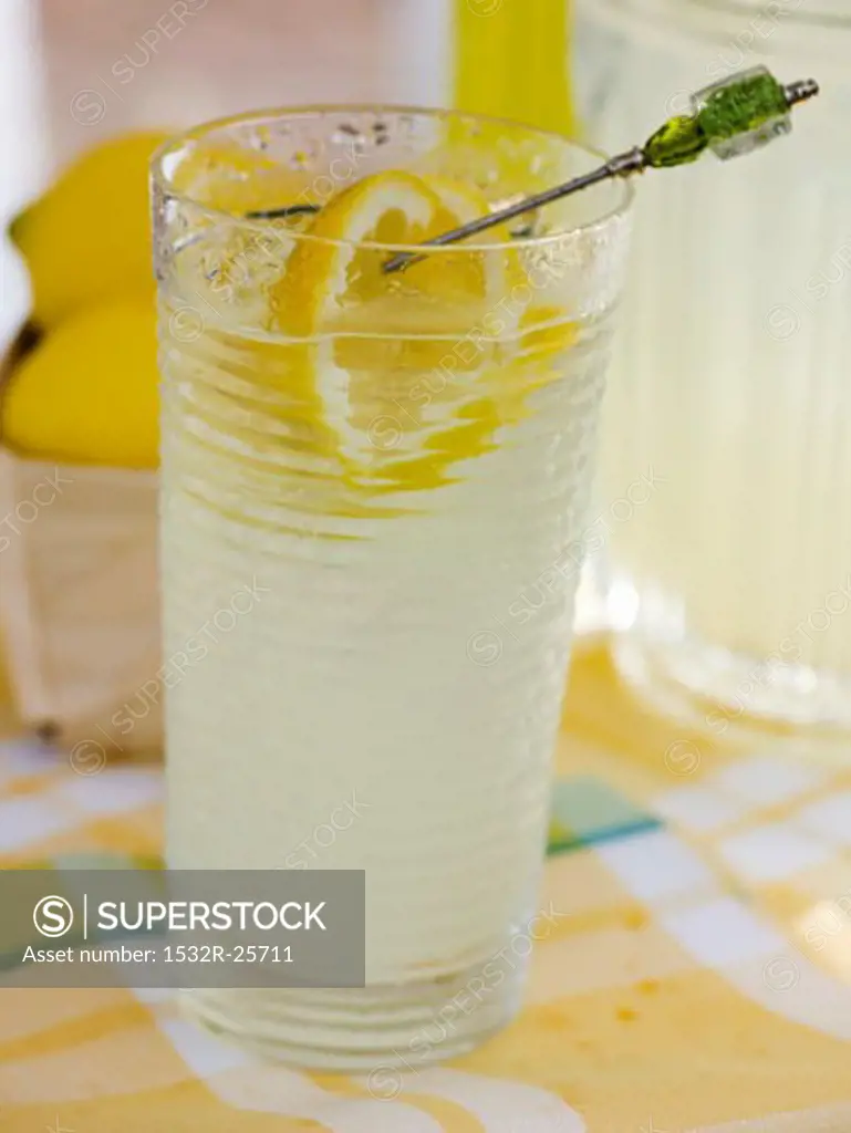 Lemonade in glass and jug