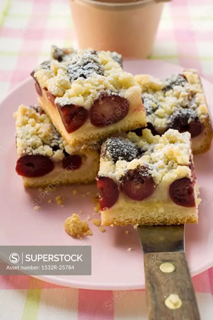 Cherry crumble cake, cut into pieces