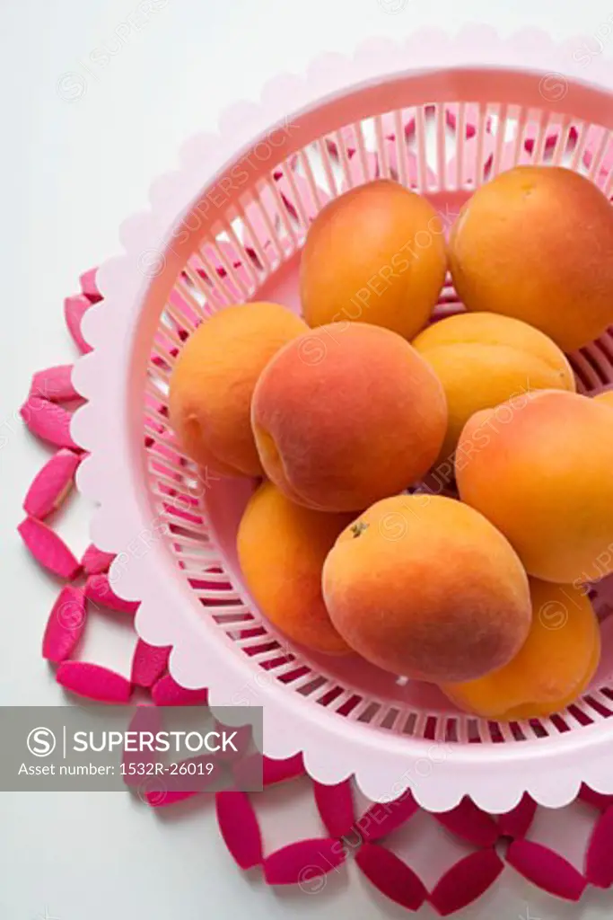 Apricots in plastic dish