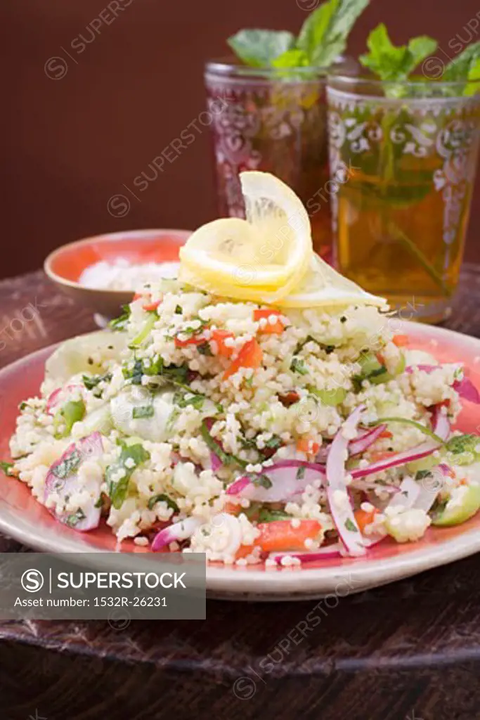 Couscous salad with vegetables, two glasses of peppermint tea