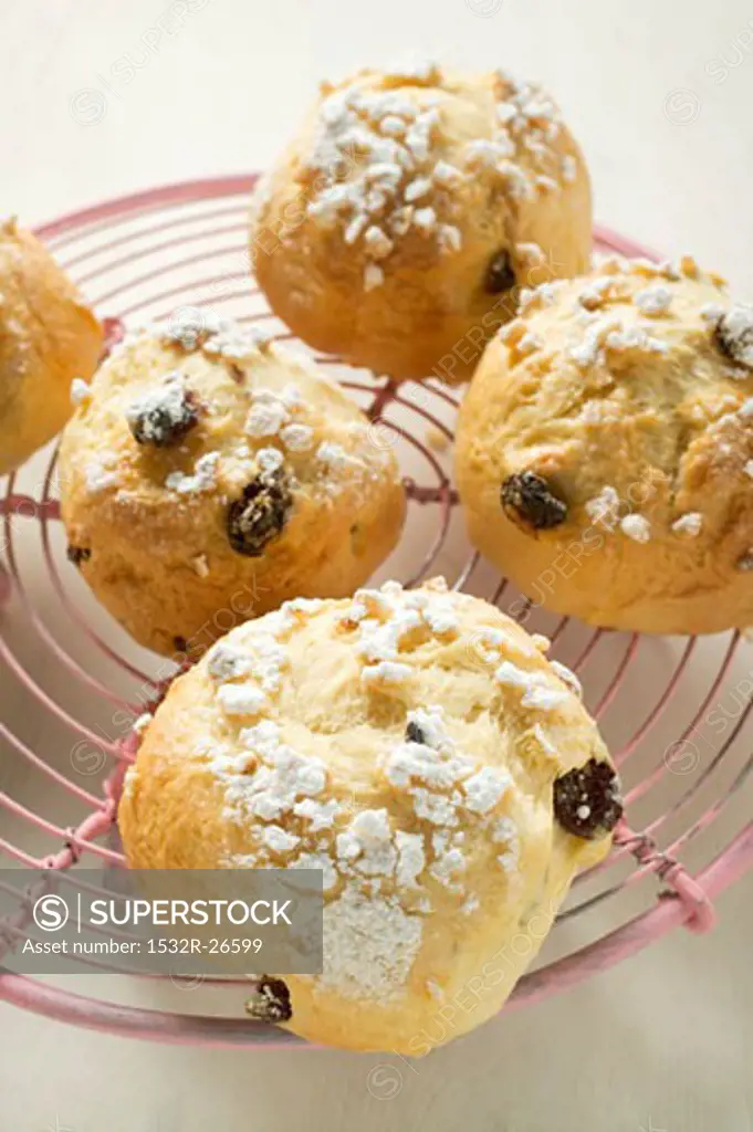 Several fruit scones with sugar on cake rack