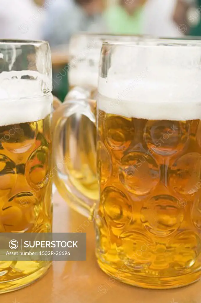 Several litres of beer on table at Oktoberfest