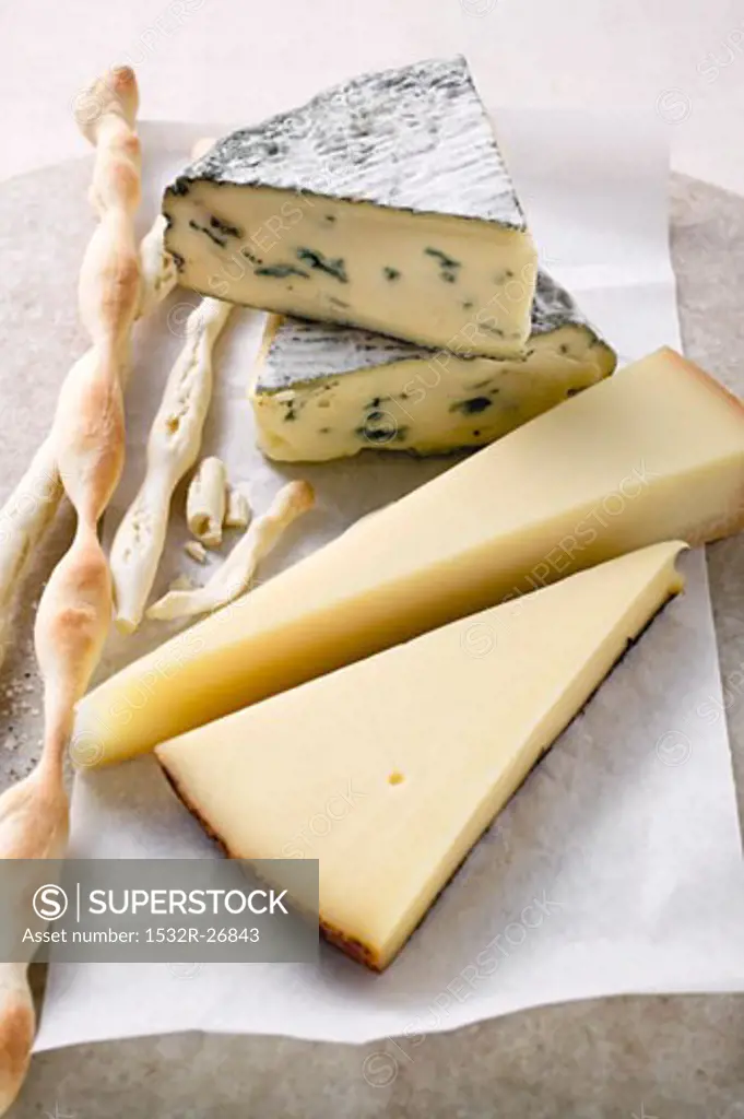 Various types of cheese and grissini
