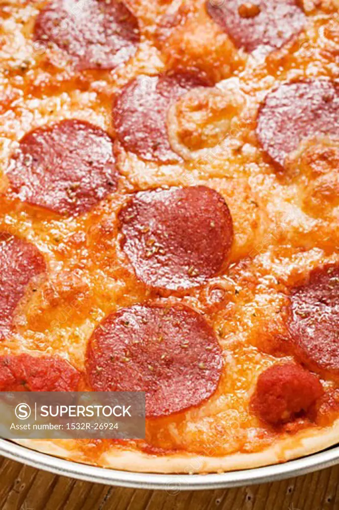 Pepperoni pizza on plate (detail)