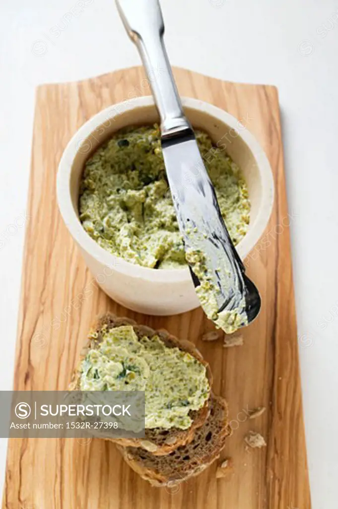 Corn salad cream with wholemeal bread and knife