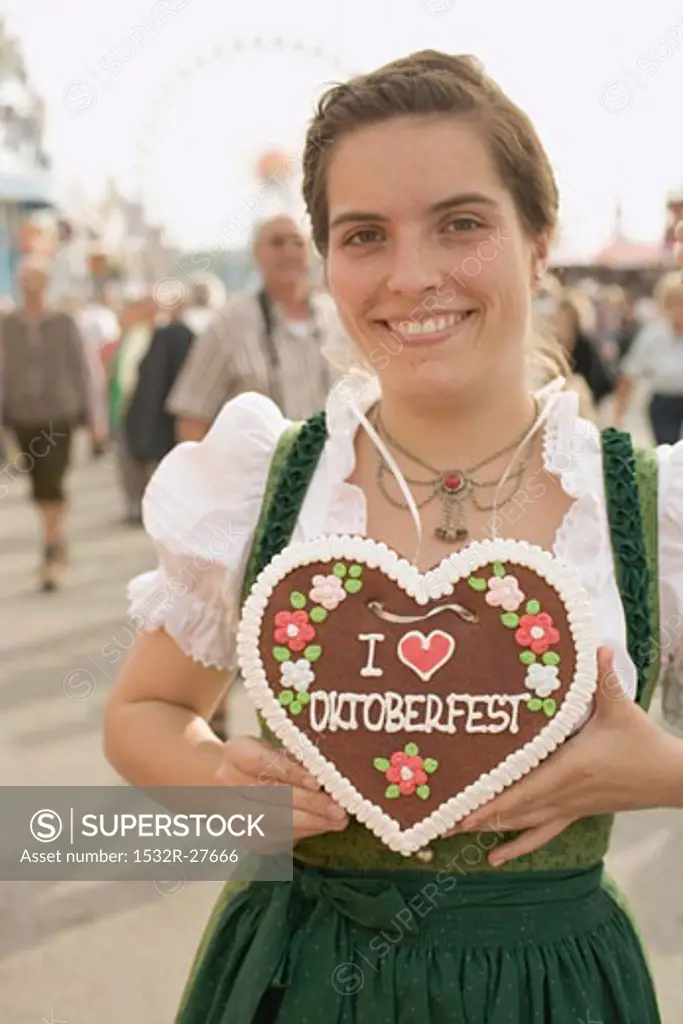 Woman with Lebkuchen heart (Oktoberfest, Munich)