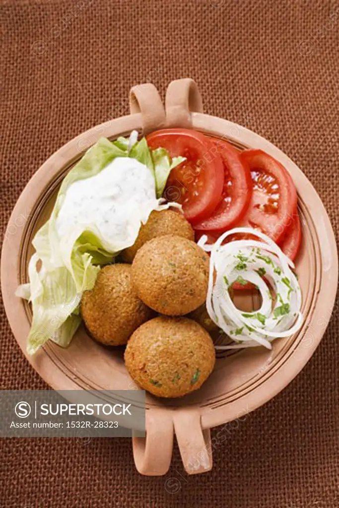 Falafel (chick-pea balls) with tomatoes and yoghurt dip