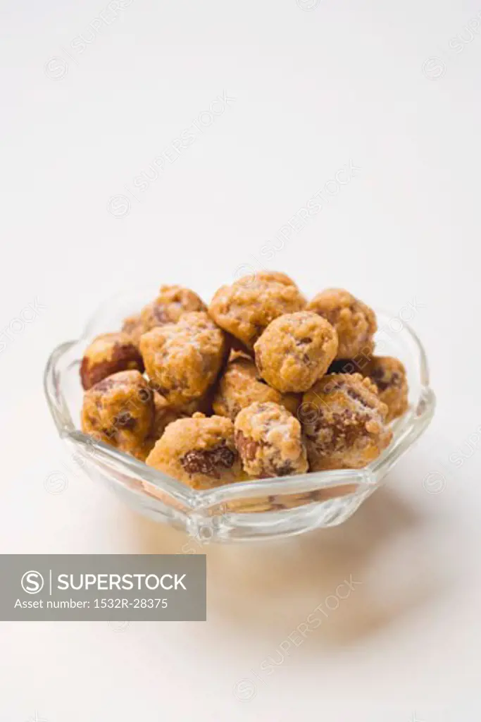 Macadamia nuts to nibble in glass bowl