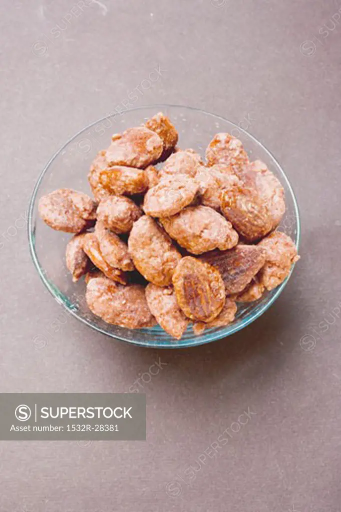 Assorted nuts to nibble in glass bowl