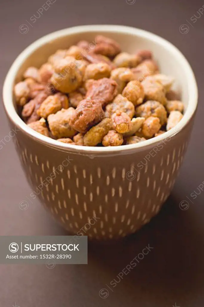 Mixed nuts to nibble in brown pot