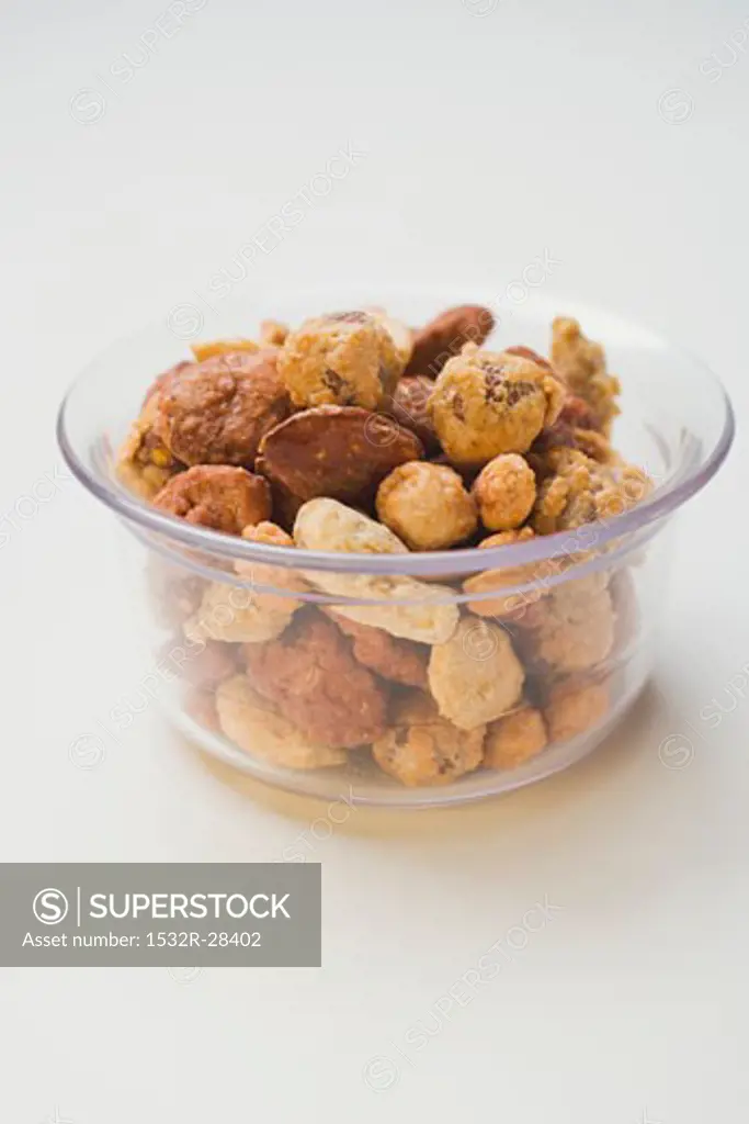 Mixed nuts to nibble in glass bowl