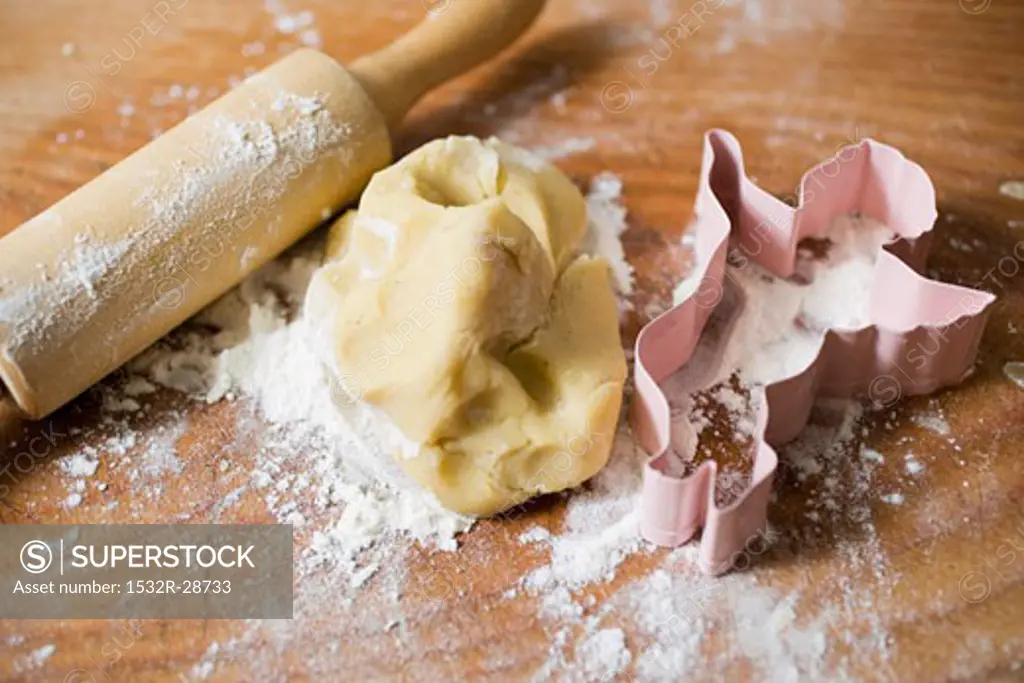 Biscuit dough, biscuit cutter, flour and rolling pin