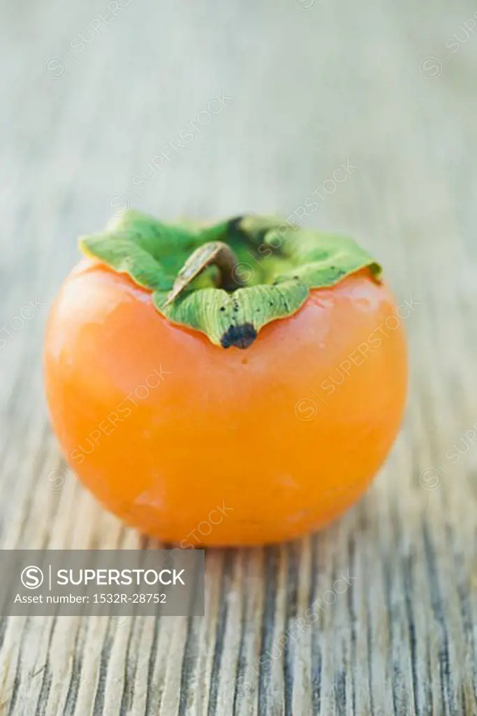 Sharon fruit on wooden background