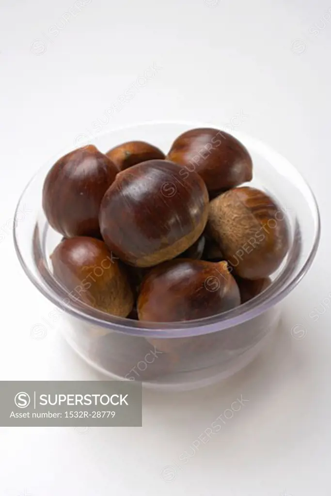 Several chestnuts in glass bowl
