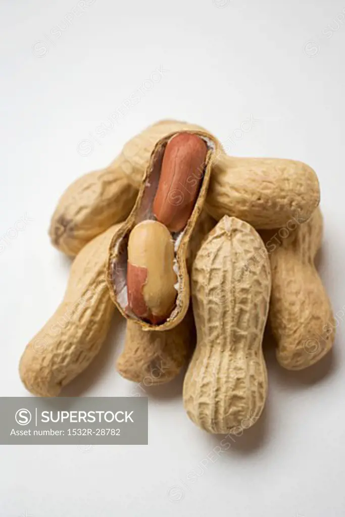 Several peanuts, one opened