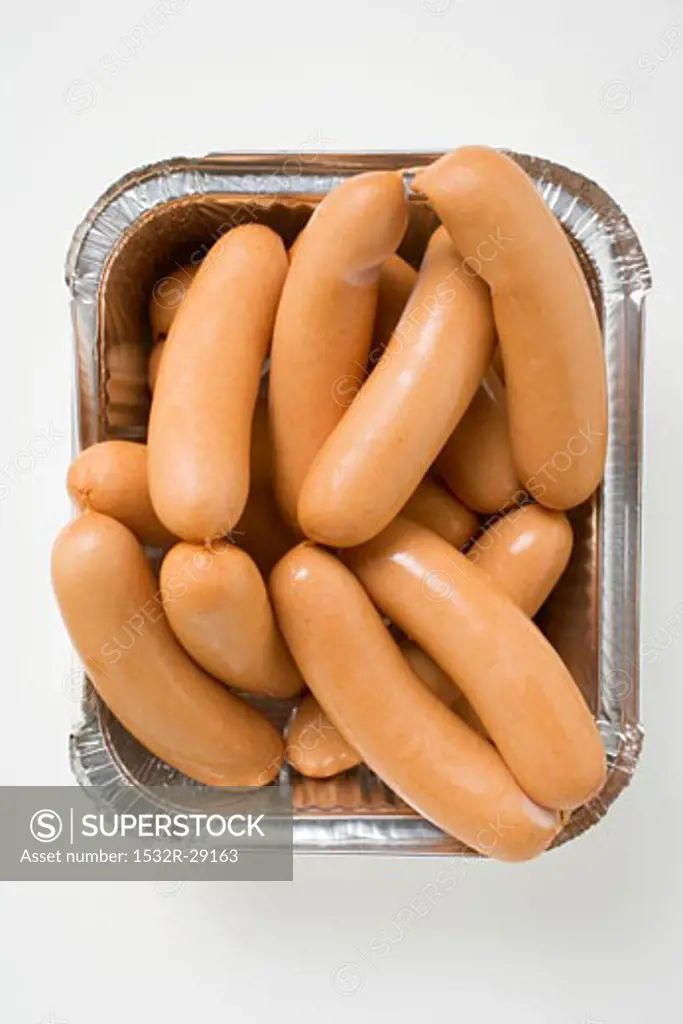 Fresh frankfurters in aluminium container