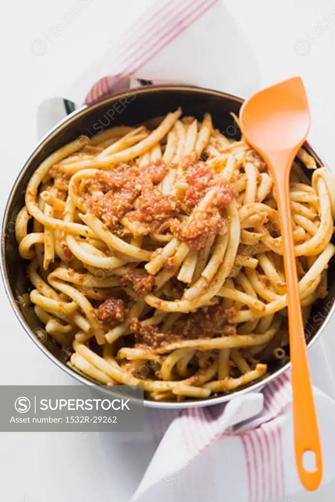 Macaroni with mince sauce in pan (overhead view)