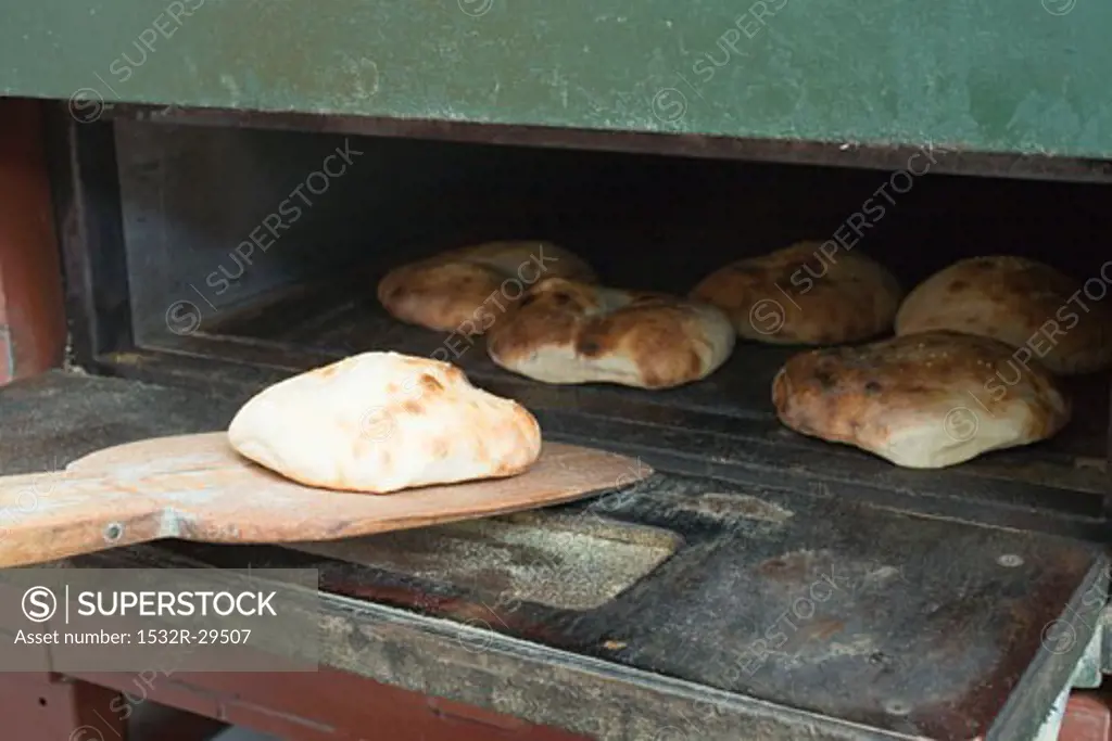 Freshly-baked pita bread in the oven