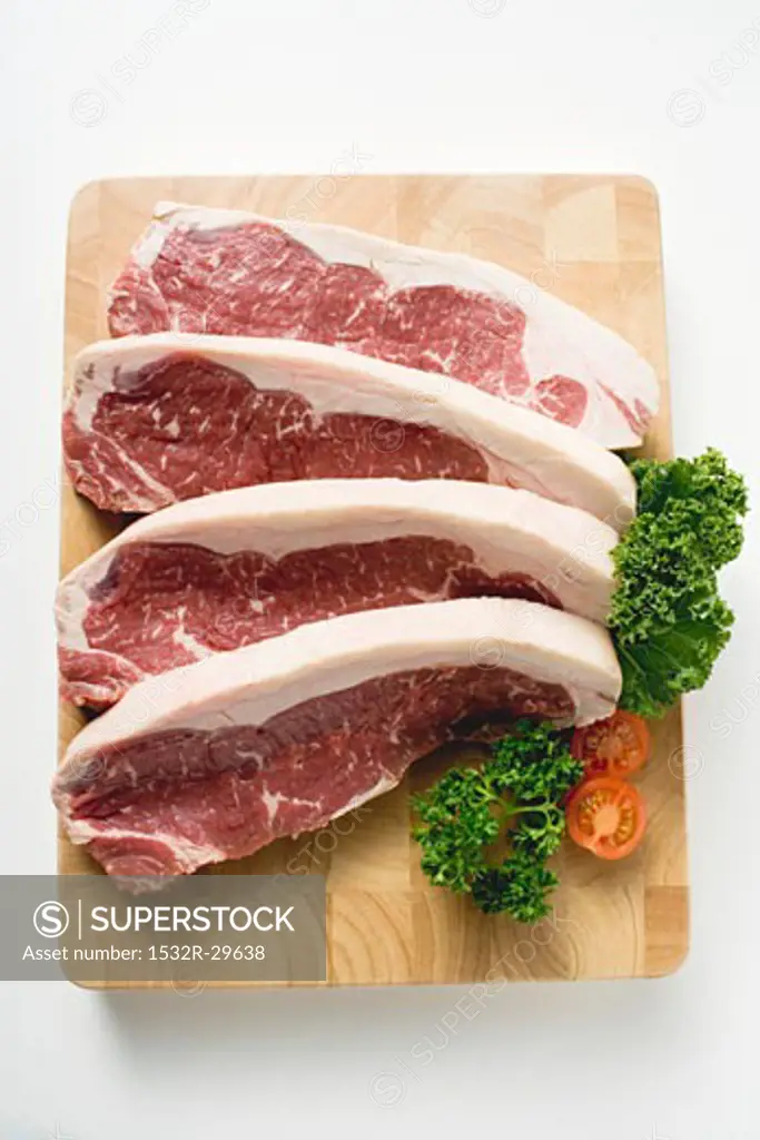 Sirloin steaks on chopping board