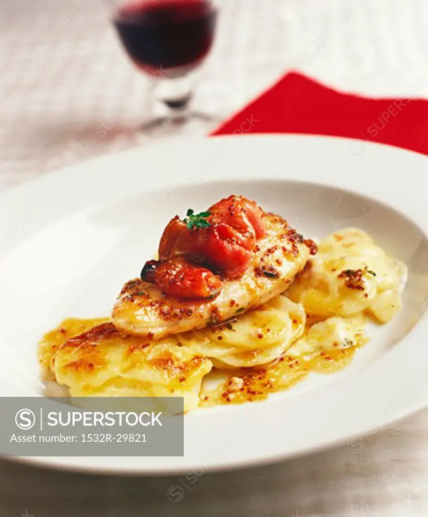 Chicken breast with tomatoes and potato gratin