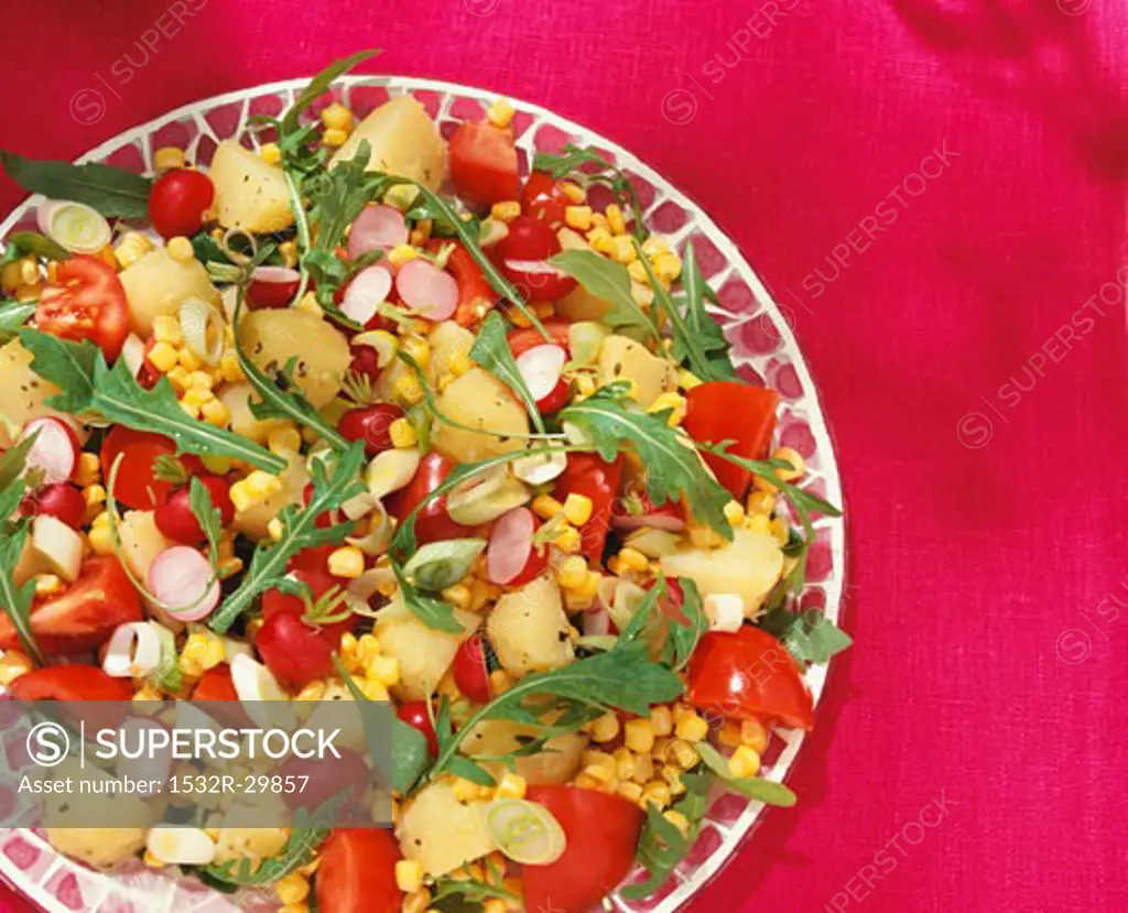 Mixed salad: potato, rocket, tomatoes, radishes & sweetcorn