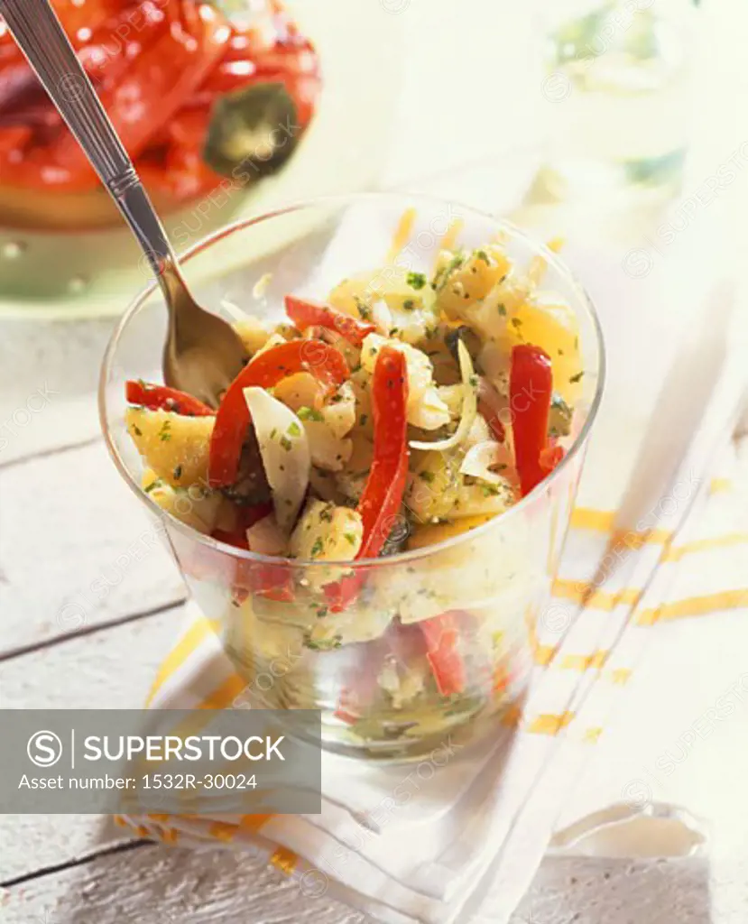 Potato salad with peppers, gherkins and herb dressing