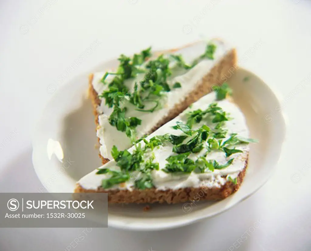 Soft cheese and parsley on wholemeal bread
