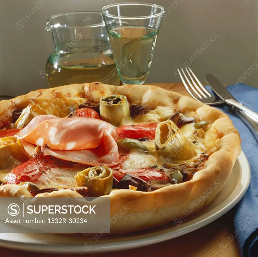 Pizza topped with artichokes and mortadella