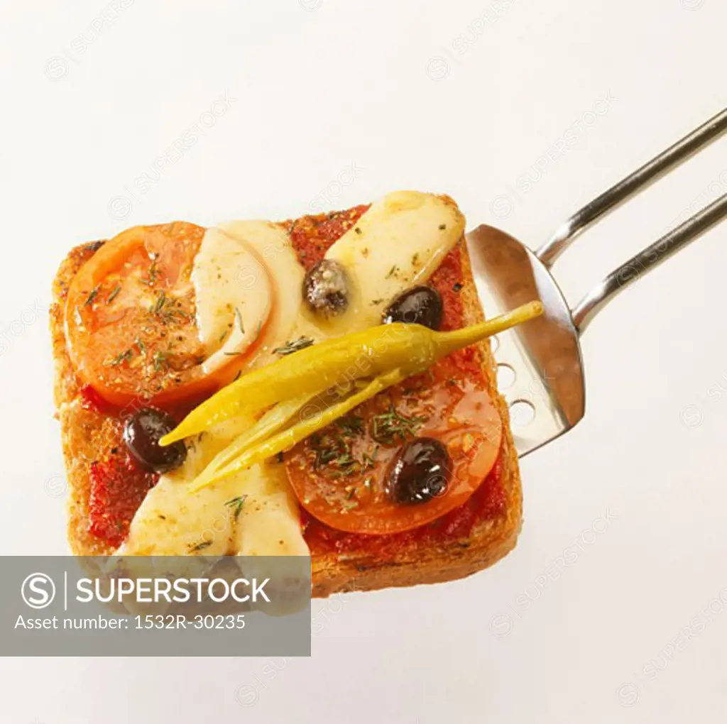 Chilli, tomato and cheese on toast