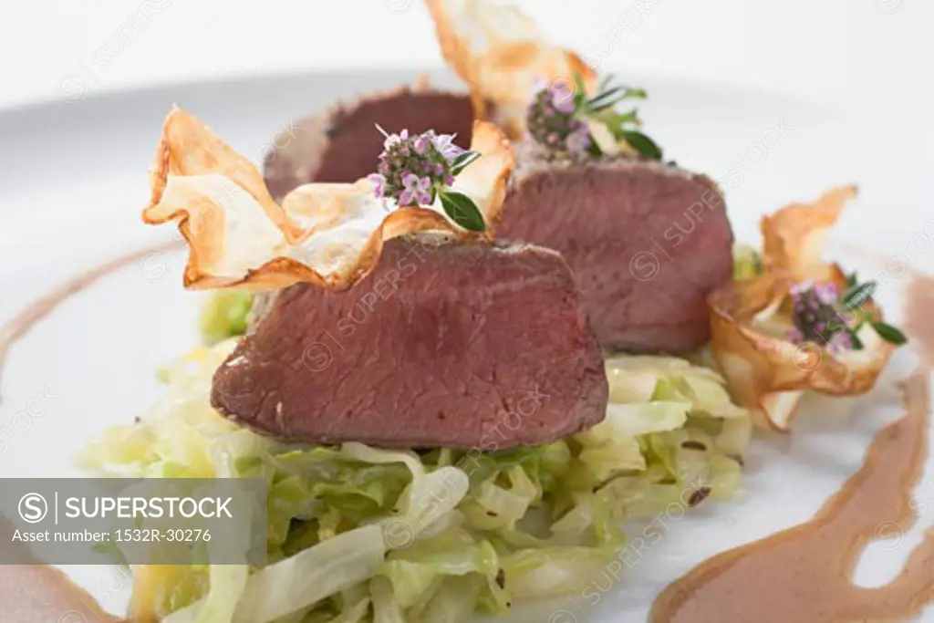 Roast venison fillet with white cabbage