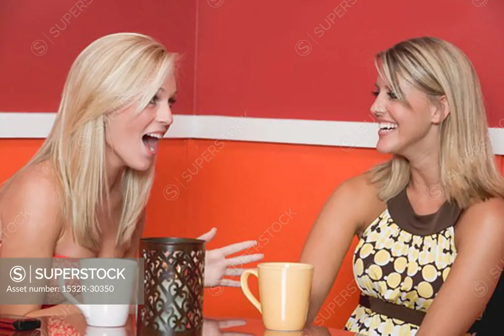Two blond girls in café