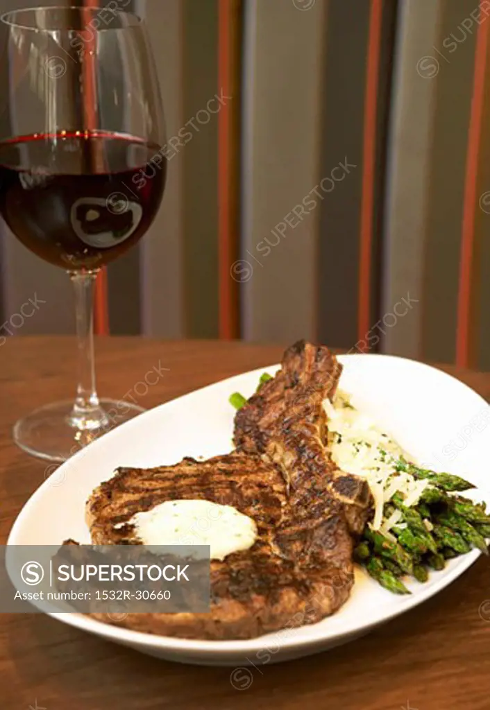 Grilled rib steak with green asparagus