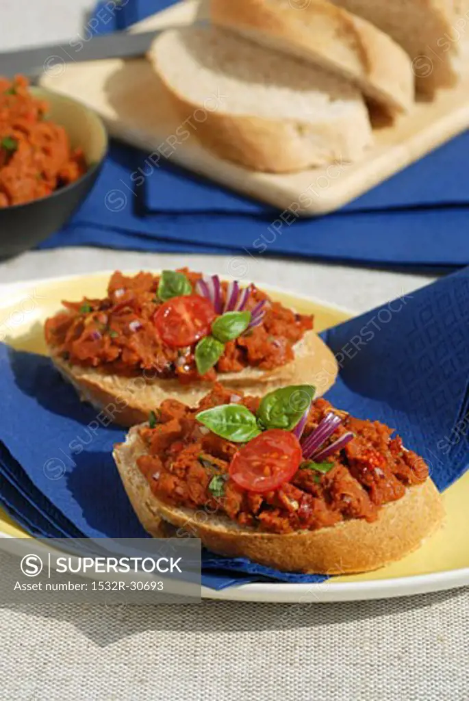 Tomato spread on baguette slices